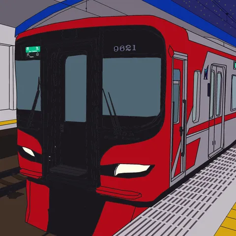 深夜の駅に停車する赤い電車