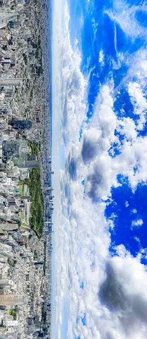 都会の空、雲と街の境界線