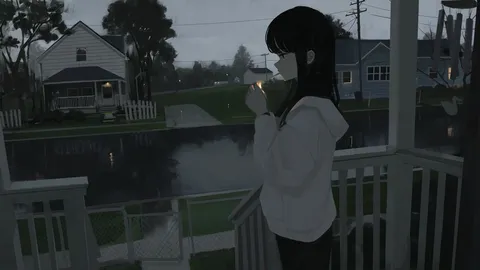 雨の縁を描く窓辺の灯り