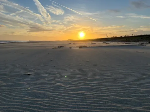 夕陽と砂紋の静かな海