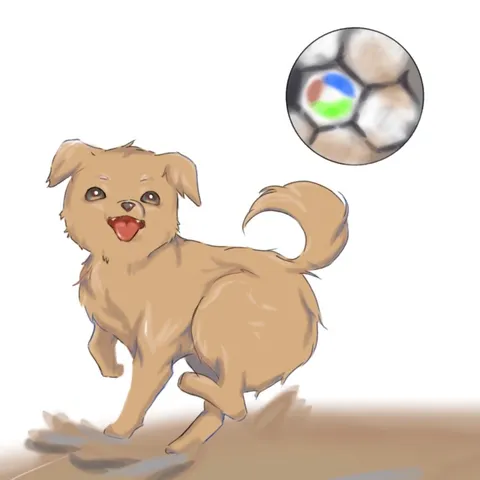 ボールを追いかける元気な子犬