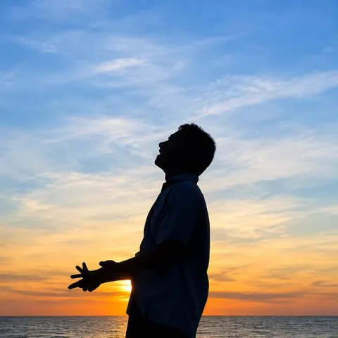 空と海に感謝する男