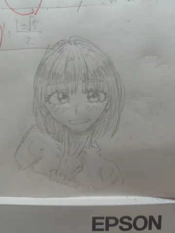 ノートに描かれた元気な微笑み
