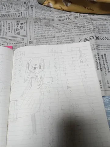 ノートに描かれた少女と新聞記事
