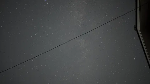 星空と電線の夜景