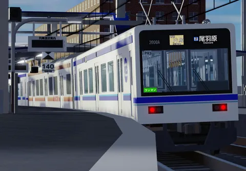駅のホームに佇む白い車両