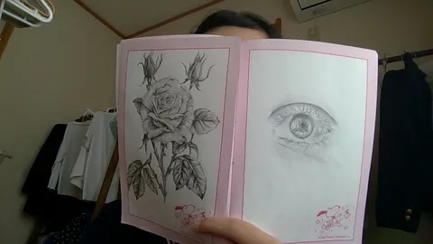 紙の中の静かな花と目の震え