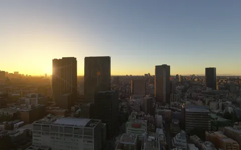 黄金に染まる都会の夜明け