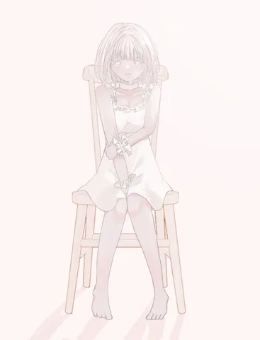 椅子に座る少女の儚げな表情