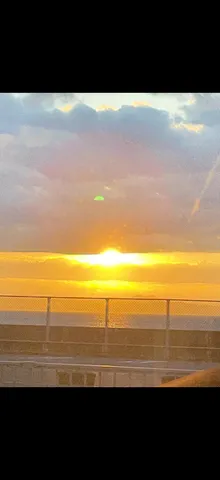 緑の光、夕陽と海