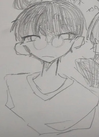 メガネ越しの静かな眼差し