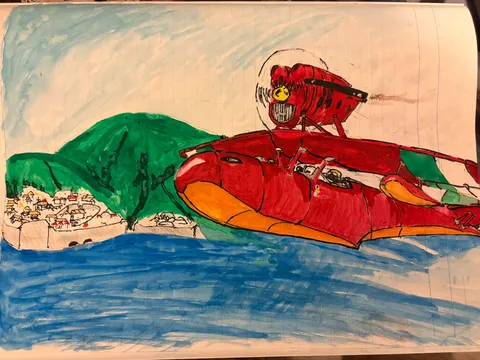 海と山を滑る赤い機体