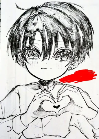 指先でハート作る少年