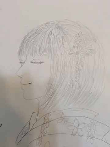 風に揺れる髪と花飾り