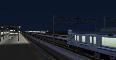 夜の駅で静かな列車を待つ