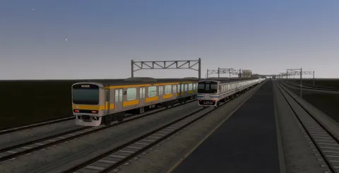 夕暮れの鉄路を走る列車