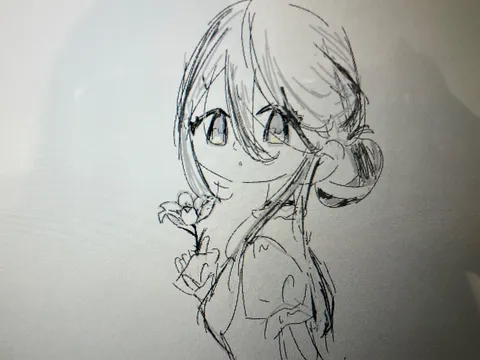 風に揺れる少女と一輪の花