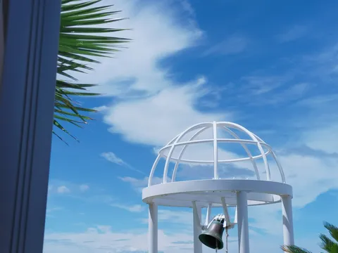 青空に映える白いドームと鐘