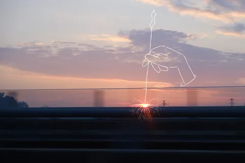 夕景に描かれた線の手