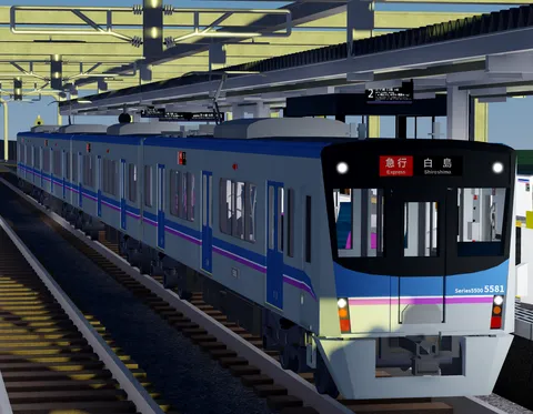 駅に停車中の急行電車