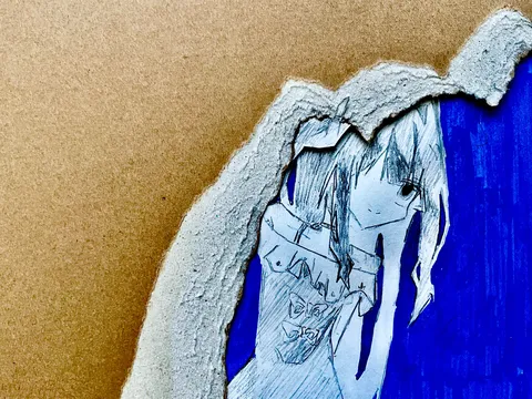 破れた紙から覗く世界