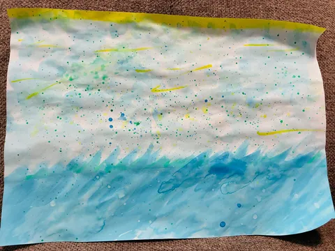 水彩で描かれた波と空
