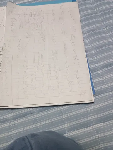 ノートの端に描かれた女の子
