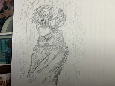 雨に濡れる少年の横顔